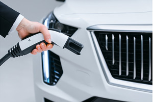 A hand is seen inserting a charging, a Technology Photo by ZinetroN
