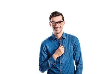 Handsome young man in denim shirt studio shot isolated featuring man, a Person Photo by HalfPoint