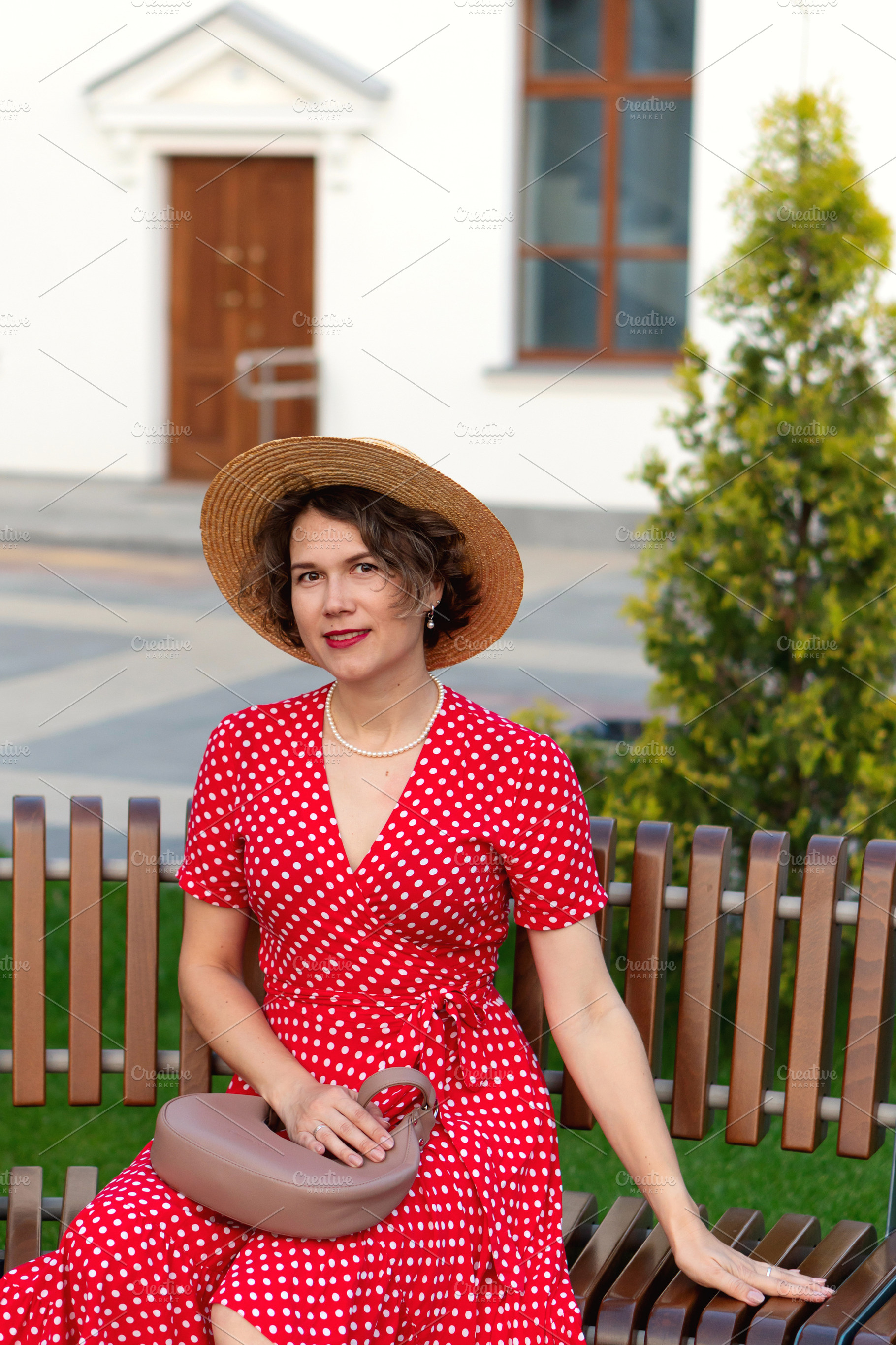 Smiling woman in red wrap dress, a Person Photo by Elena Vagengeim