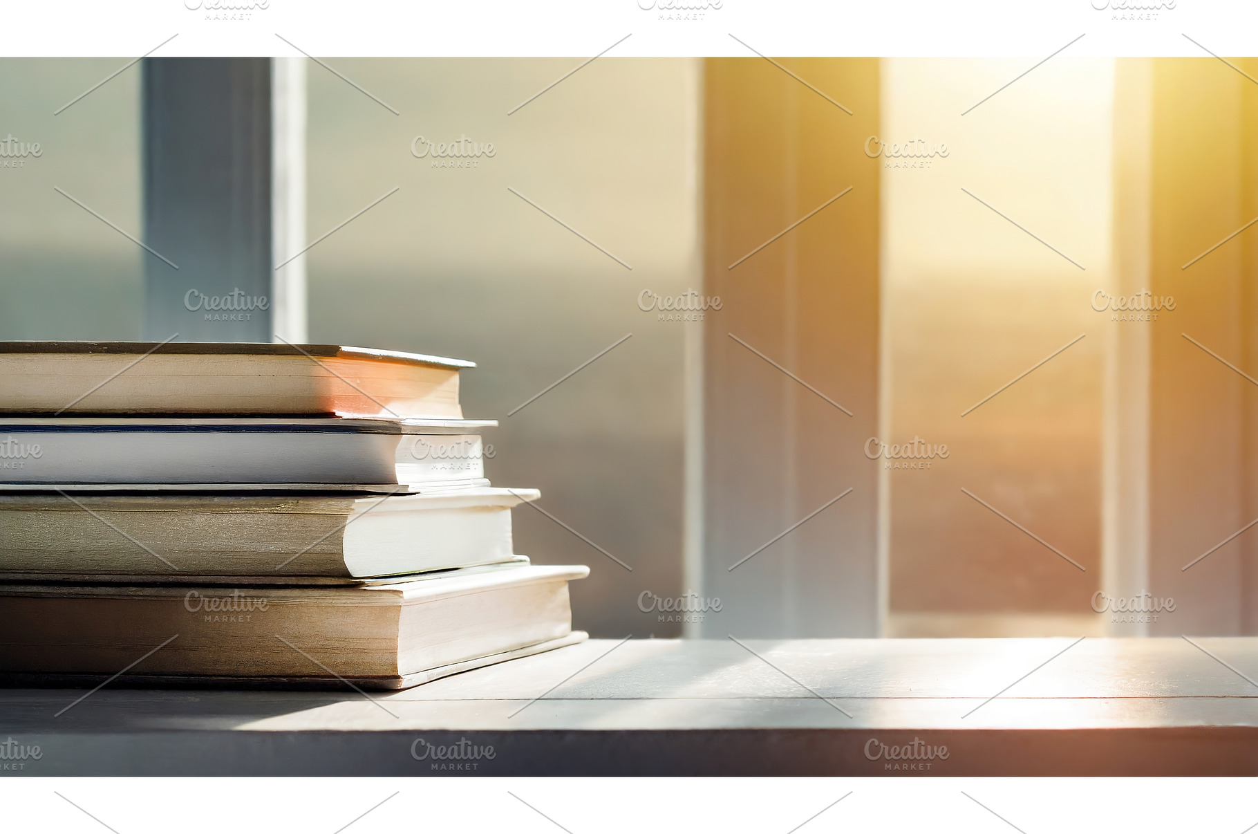 A stack of books by a sunlit window, a School & Education Photo by Igor Tichonow
