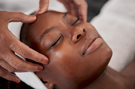 Black woman, relax face and luxury spa massage of a young female ready for facial. Skincare, beauty and wellness clinic with client feeling calm and zen from cosmetic chemical peel treatment, a Photo by Peopleimages.com