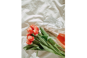 Bunch of red tulip and rose wine on, a Holiday Photo by Fascinadora