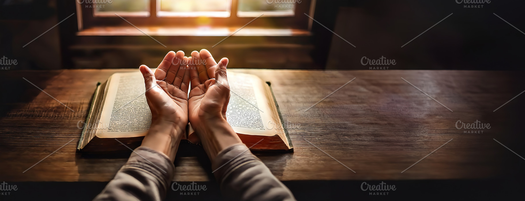 Person praying with open hands above a book, a Person Photo by Igor Tichonow
