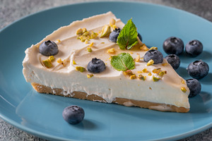 Creamy Mascarpone Cheesecake Slice Served With Blueberries Pista, a Food & Drink Photo by Alexander Prokopenko