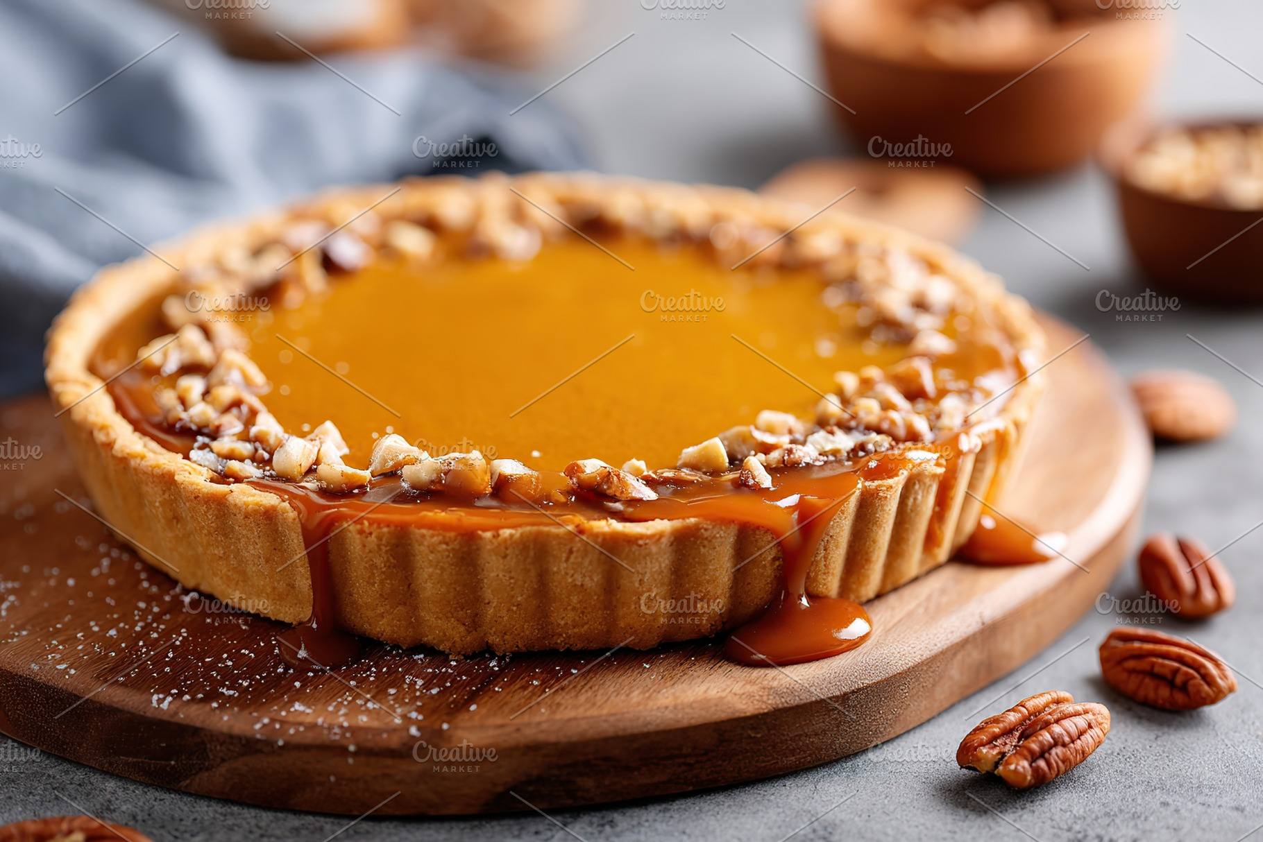 Homemade pecan pie dessert with caramel drizzle on a wooden platter, a Photo by AlyaAnd