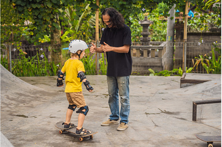 Athletic boy learns to skateboard, a Sports & Recreation Photo by Elizaveta Galitskaya