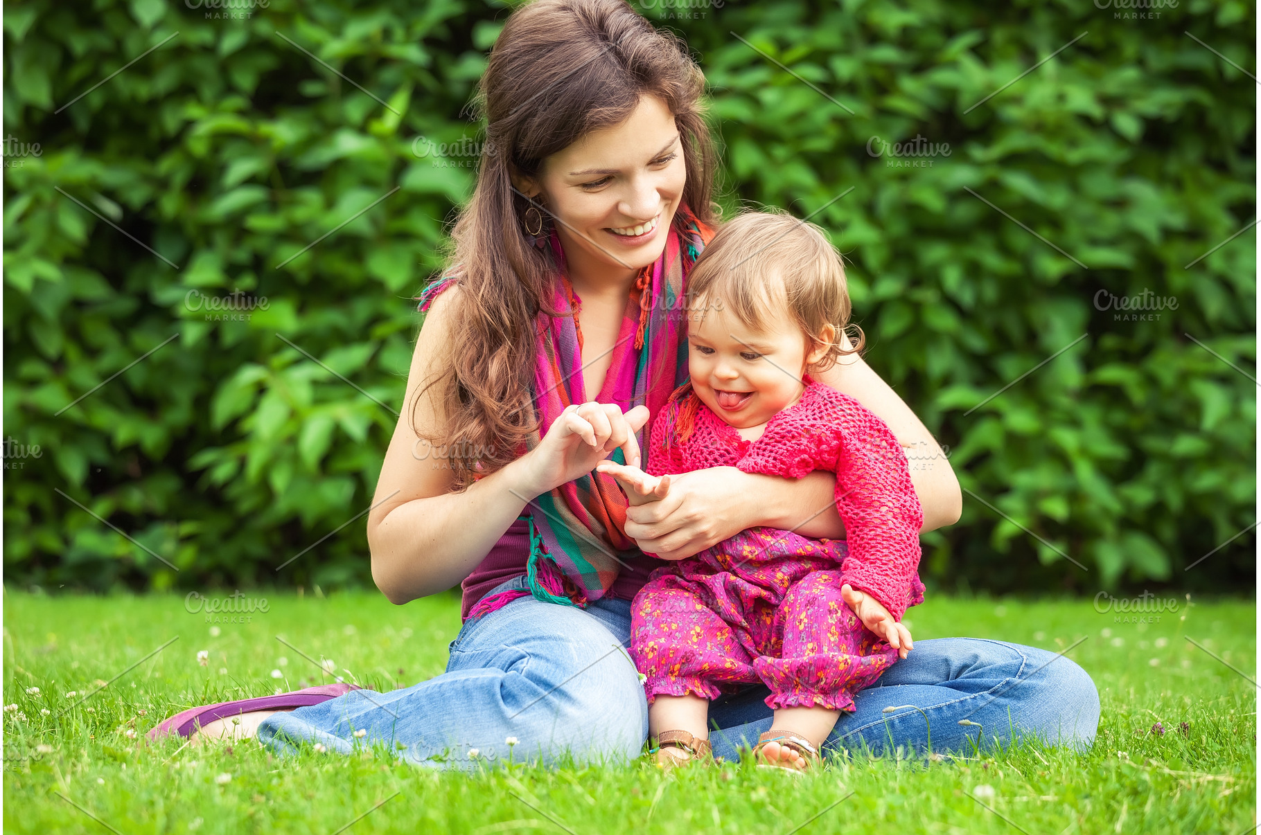 Mother with baby in the park, a Person Photo by sborisov