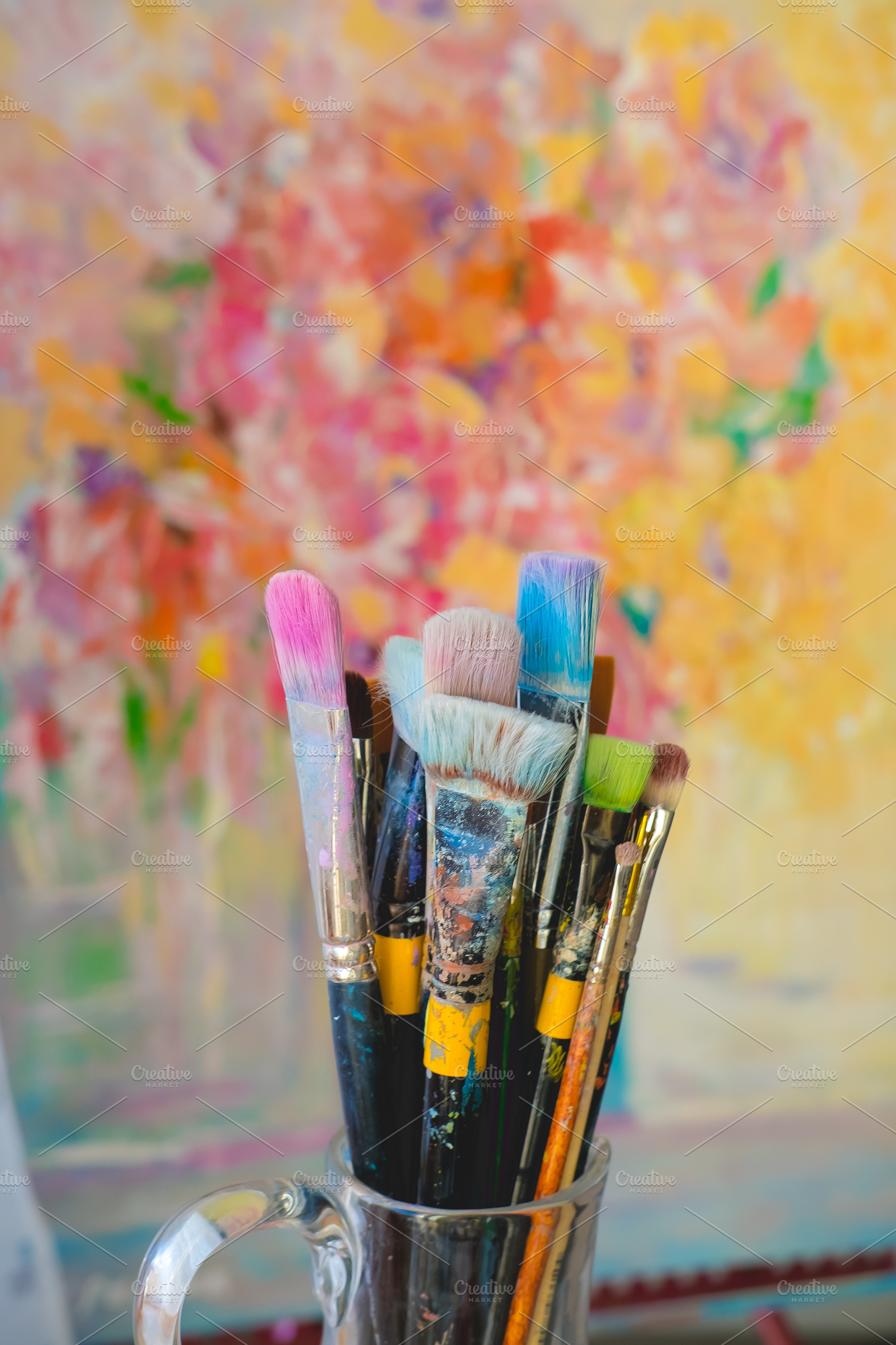 Paint brushes and colorful canvas, an Arts & Entertainment Photo by Valeryia P.