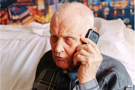 Elderly man engaged in a phone