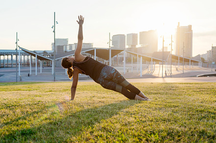 A Young woman doing yoga exercise outdoor, a Sports & Recreation Photo by 2Design