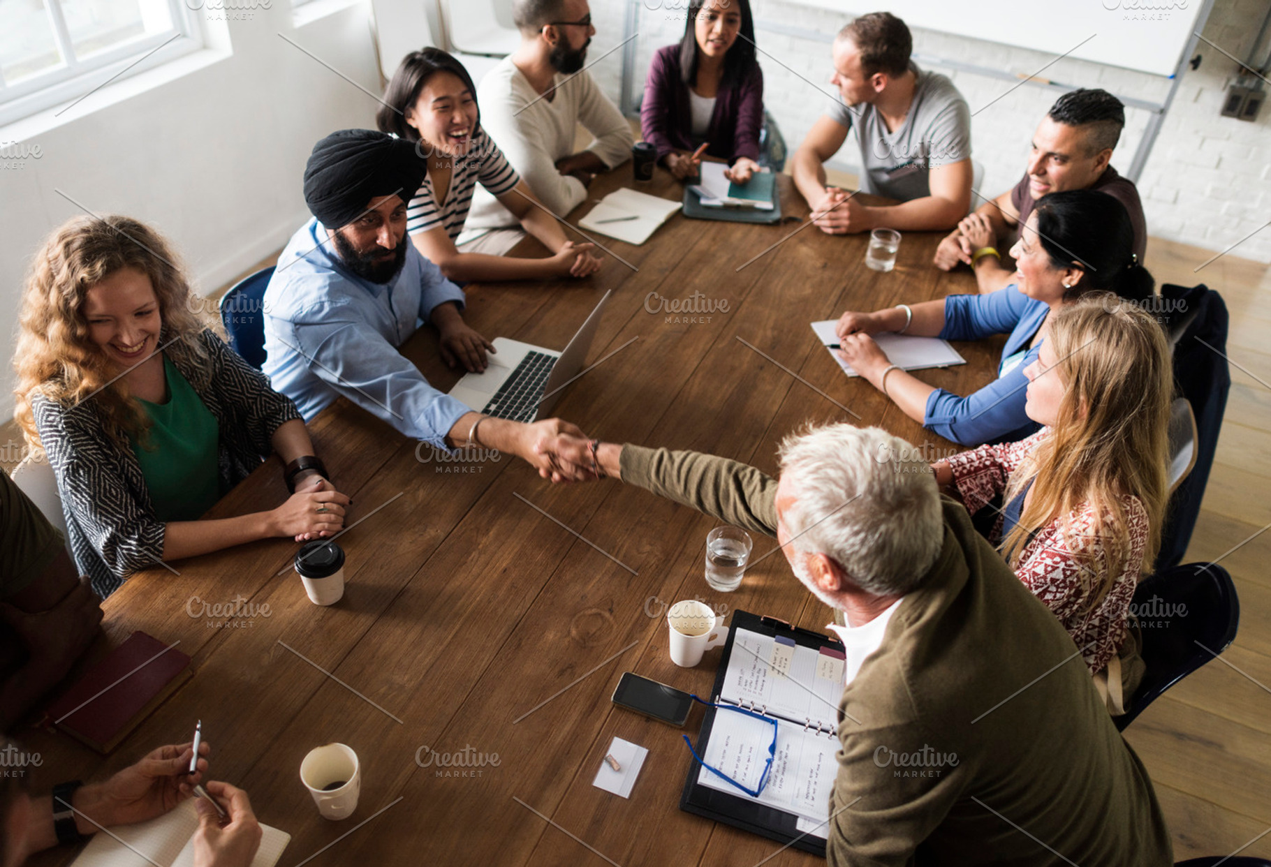 Diverse group of people in a seminar featuring person, collaboration, and, a Person Photo by rawpixel
