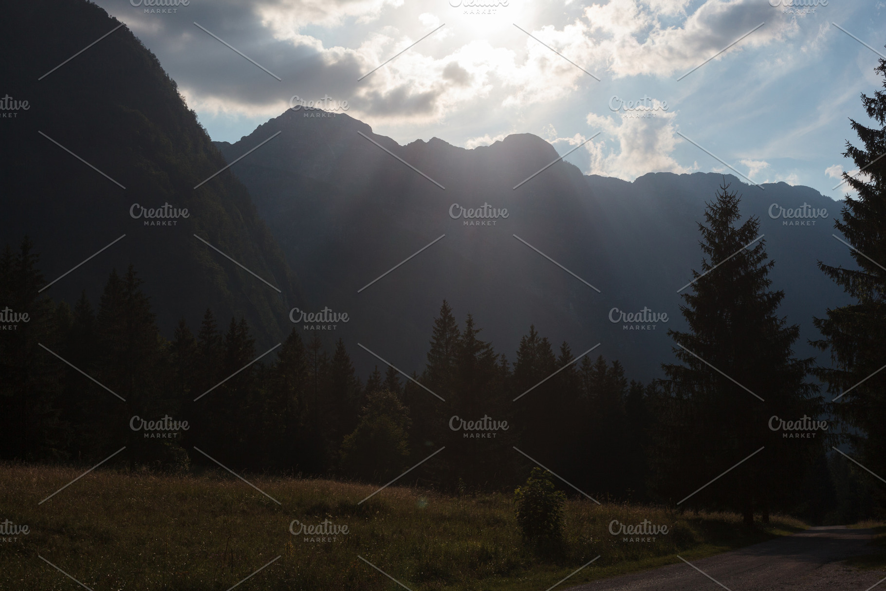 Sun rays or god rays over the Julian Alps in Slovenia, a Nature Photo by Bepslabor