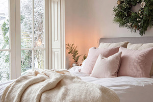 Cozy bedroom interior for winter holidays, featuring a comfortab, a Photo by Studio ANNA