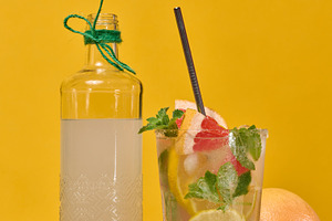 Glass bottle with homemade lemonade and a glass with a cold cock, a Food & Drink Photo by ndanko