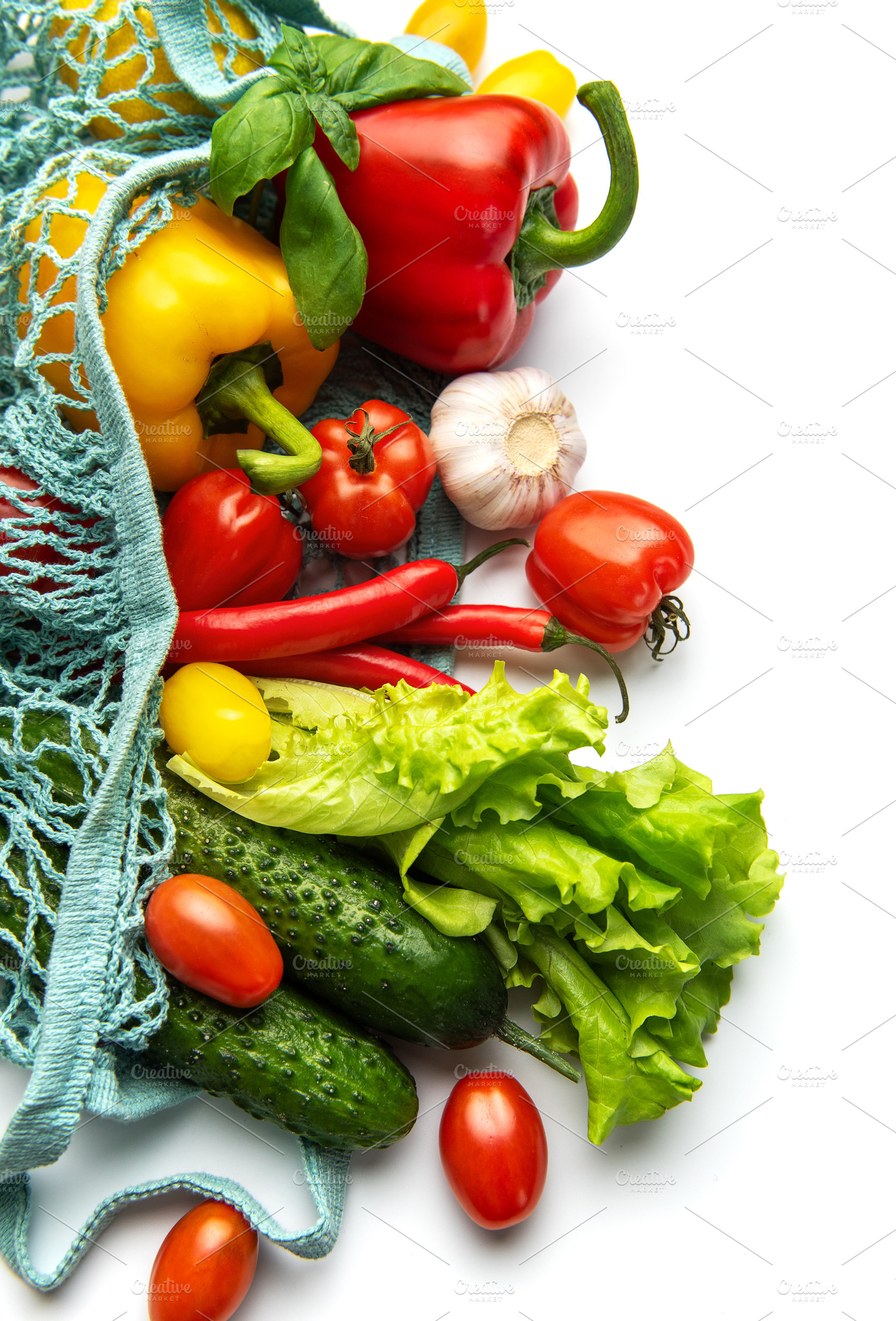 Fresh organic vegetables in a reusable mesh bag, a Photo by Olena Rudo