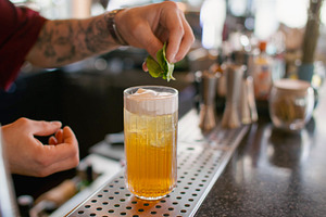 Serving drink barkeeper work mint cocktail cream, a Food & Drink Photo by Photo Drive Studio