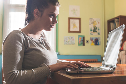 Student girl and laptop in a library stock photo containing laptop and library, a School & Education Photo by Deyan Georgiev