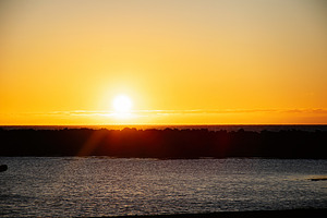 Golden sunset over Icelandic coastline witnessing serene and tranquil evening v, a Nature Photo by AS photostudio