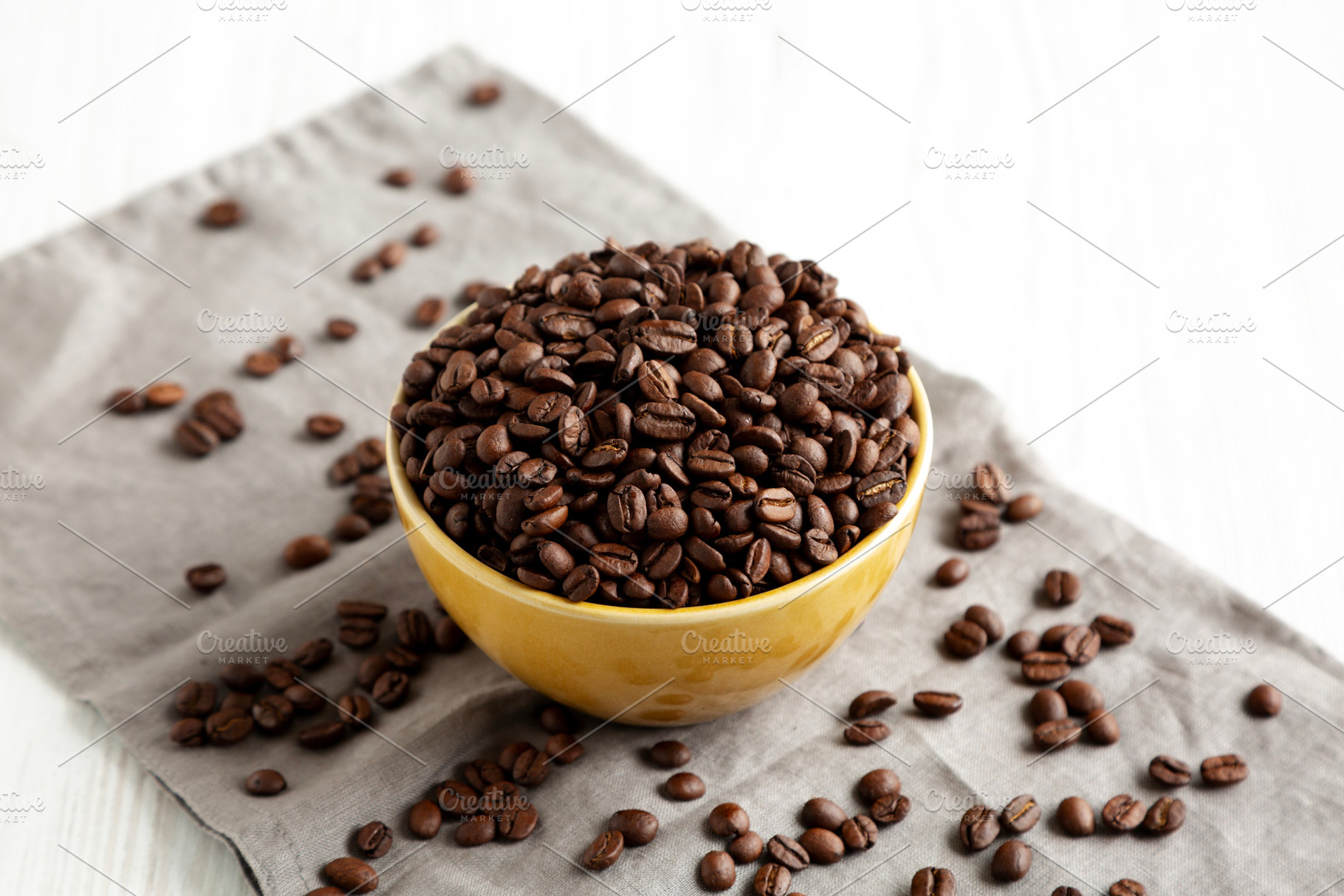 Organic Roasted Coffee Beans in a Bowl, side view., a Food & Drink Photo by LiudmylaChuhunova