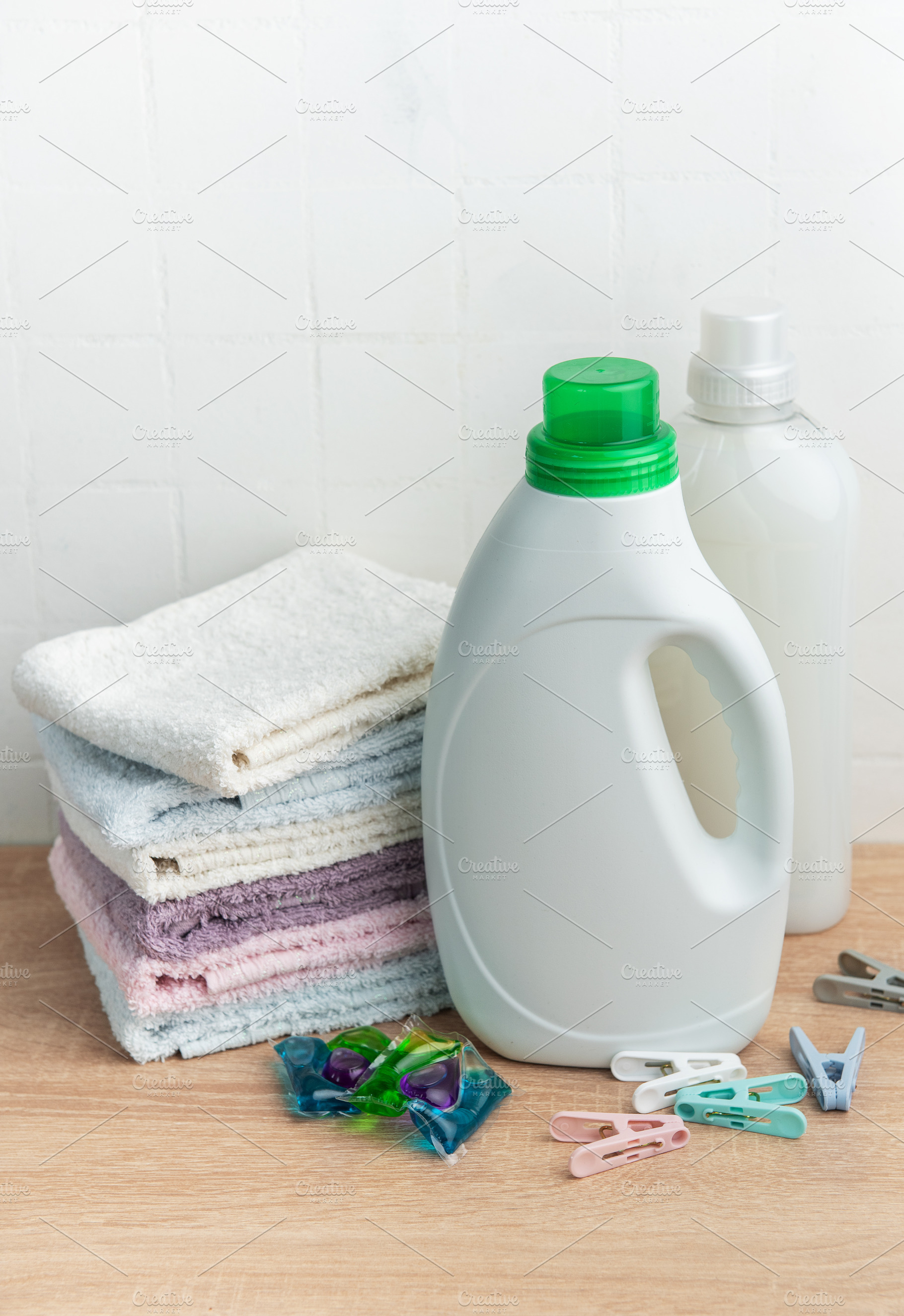 Laundry supplies and folded towels for household chores, an Industrial Photo by Olena Rudo