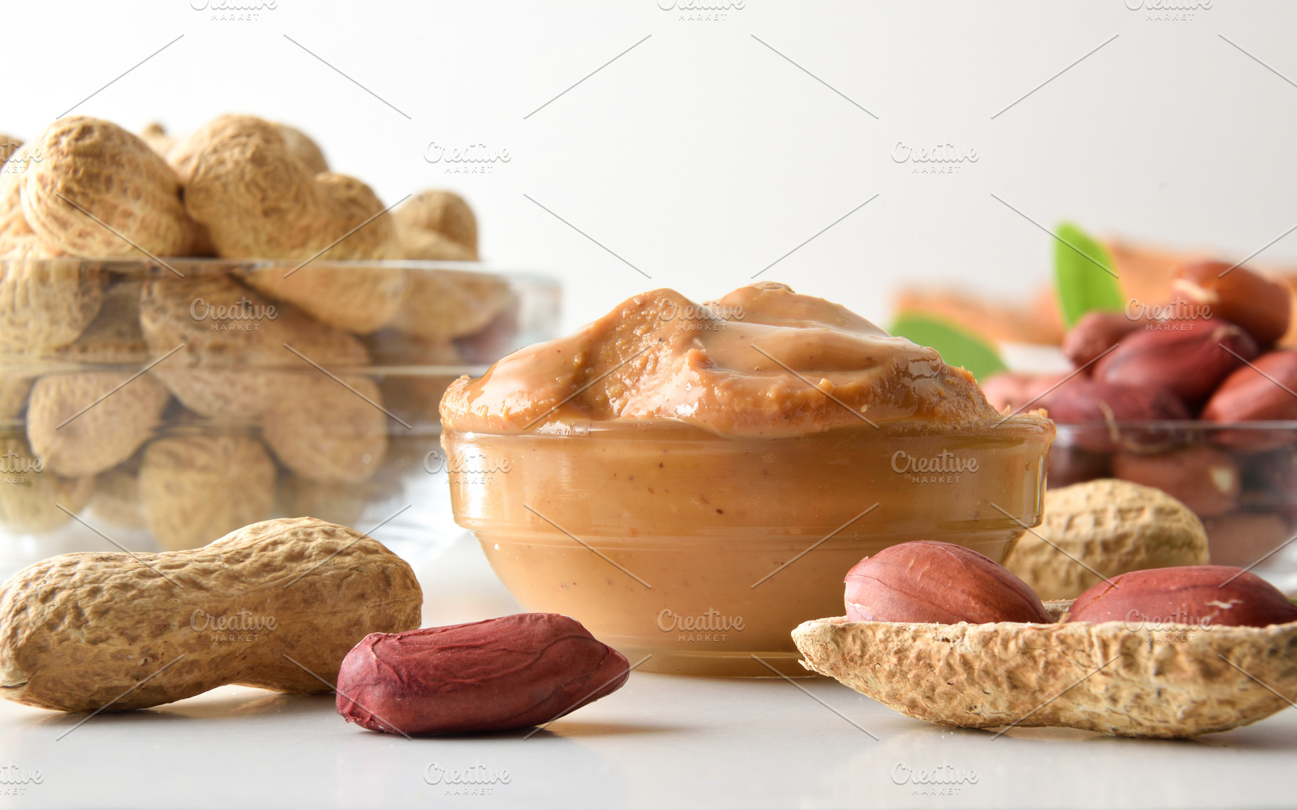 Detail of bowl full of peanut butter and fruits around, a Food & Drink Photo by Davizro's Market