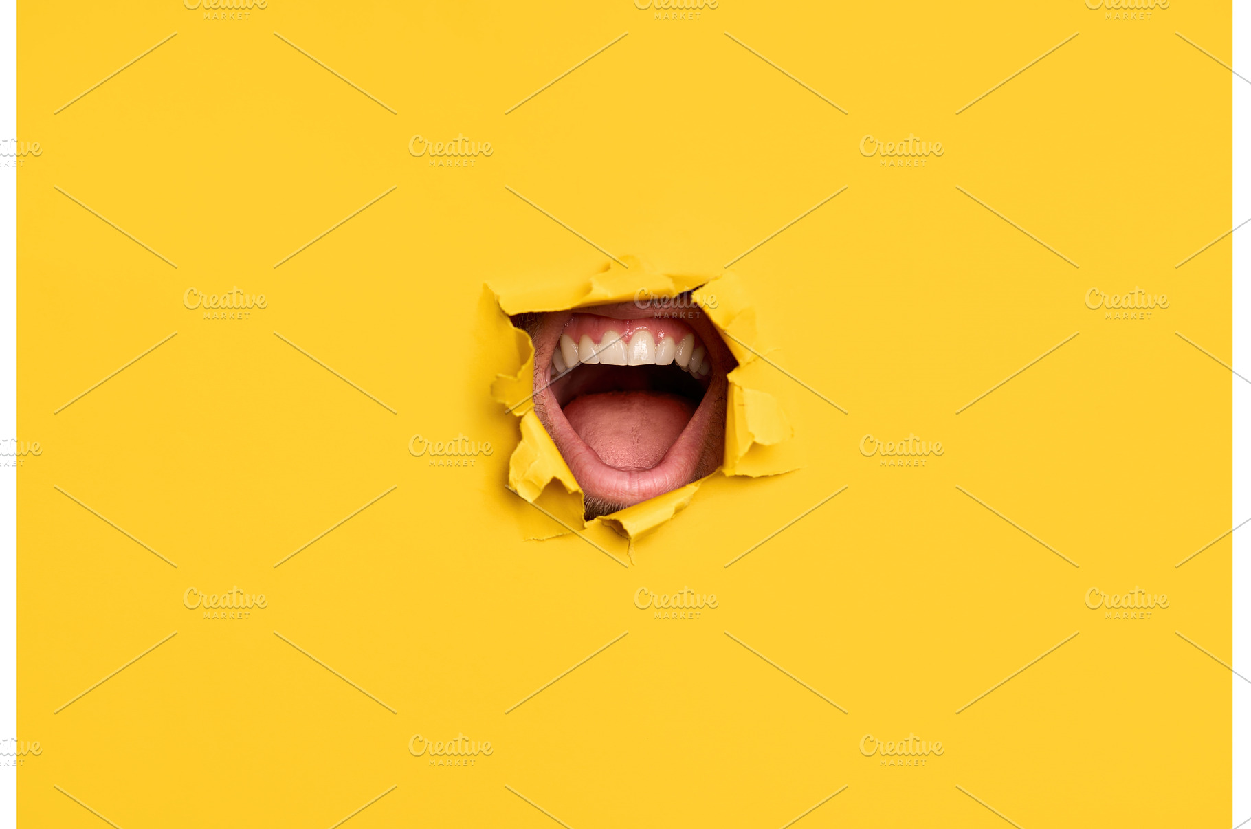 Open mouth through torn yellow pape, an Arts & Entertainment Photo by Gladkov photography