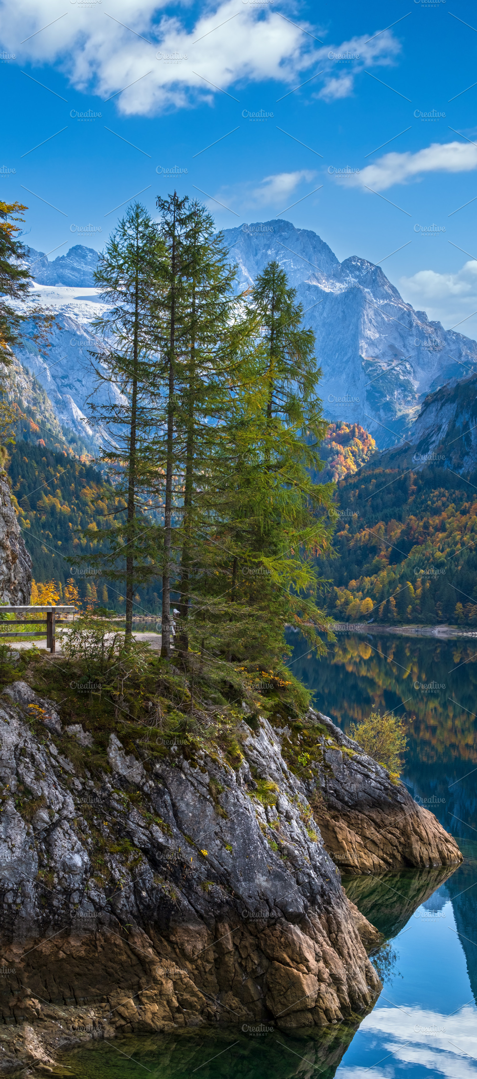 Peaceful autumn Alps mountain lake with clear transparent water, a Nature Photo by YuriyB