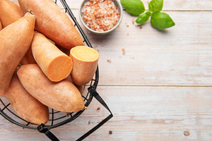 Sweet potato harvest in a basket with pink salt and basil, a Food & Drink Photo by Olena Rudo