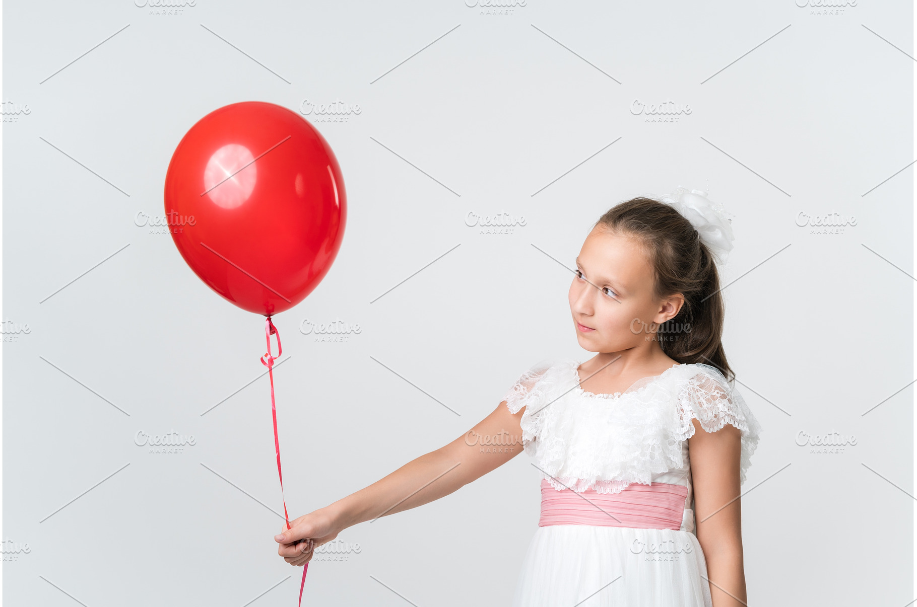 Pretty girl in white dress holding, a Person Photo by Alexander-Piragis