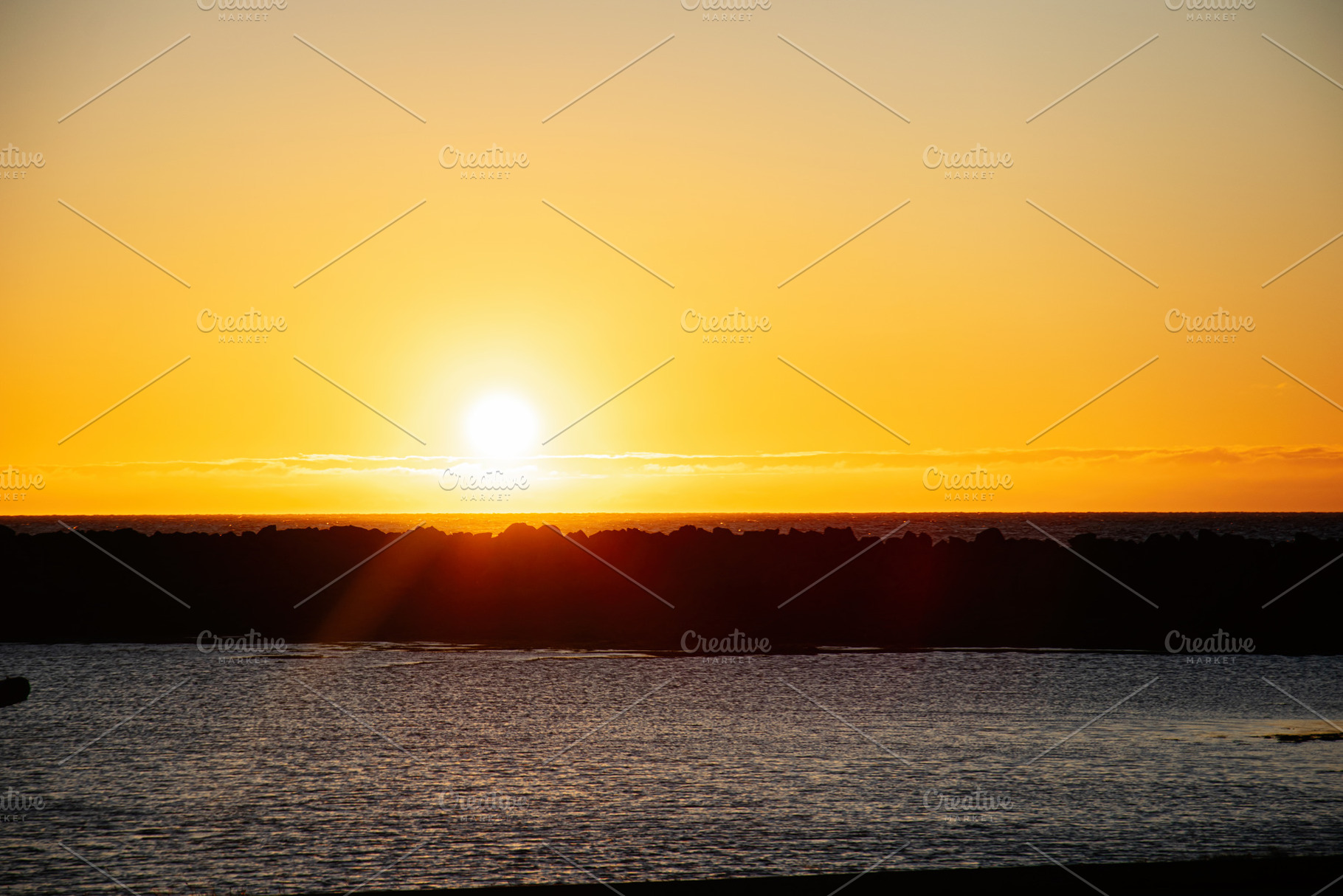 Golden sunset over Icelandic coastline witnessing serene and tranquil evening v, a Nature Photo by AS photostudio