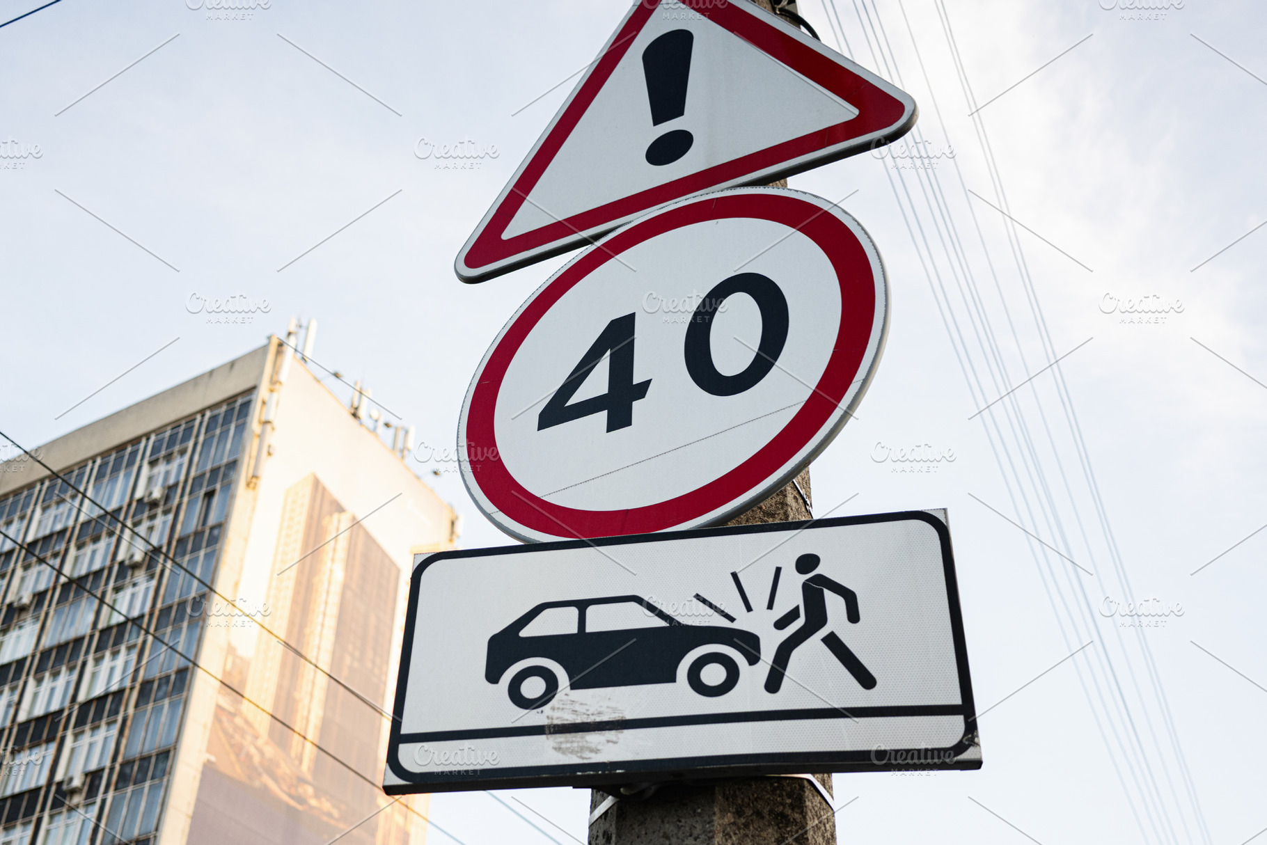 Urban road sign warning about speed limits and pedestrian safety in a city, a Photo by AS photostudio