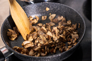 Mushrooms being in a skillet with a, a Food & Drink Photo by darksoul72