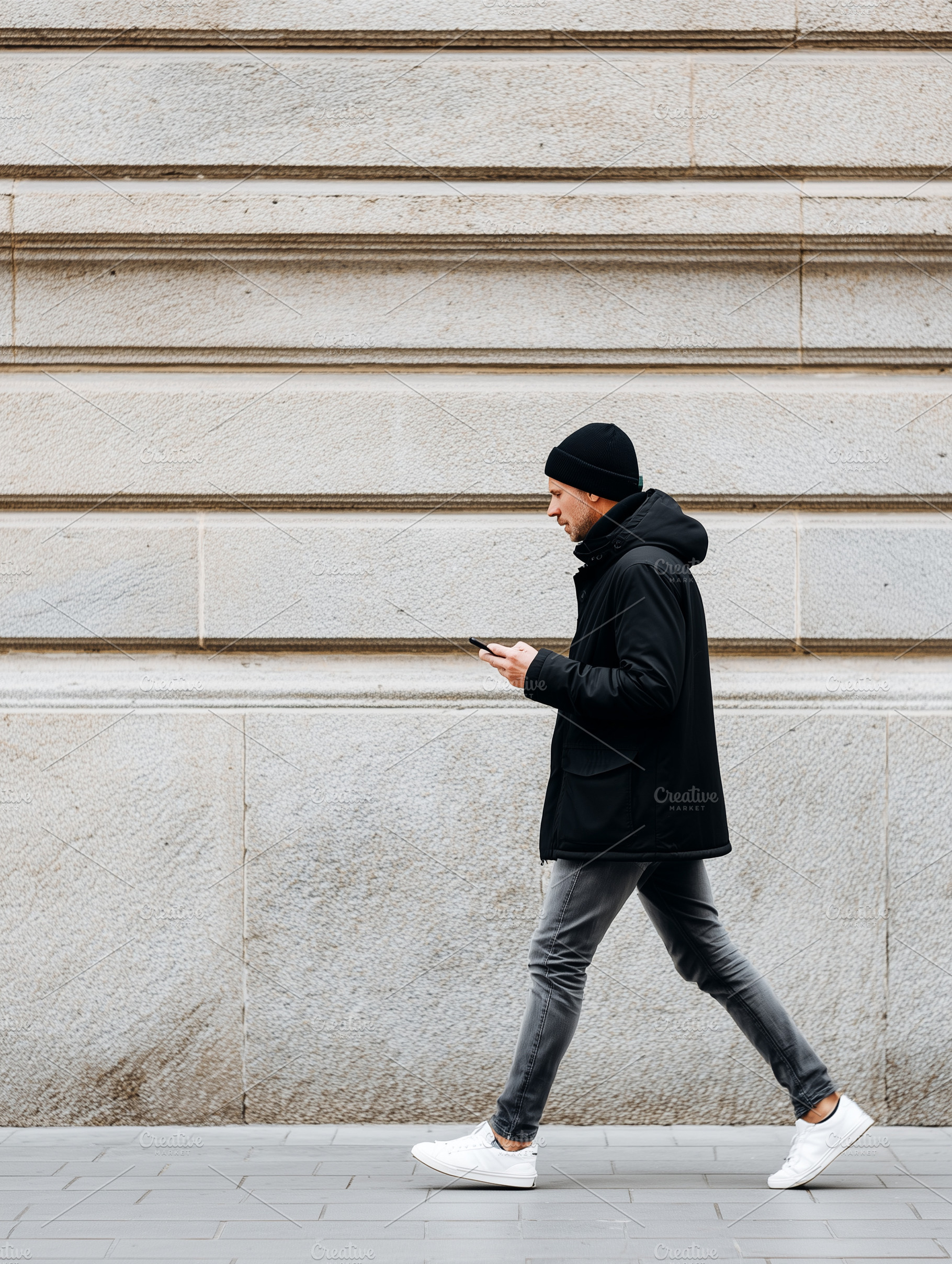 Modern man walking along a city, a Person Photo by MistyDay