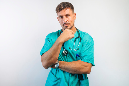 Serious Doctor with Hand on Chin Thinking