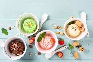 Homemade assorted ice cream in a featuring ice cream, pistachios, and icecream