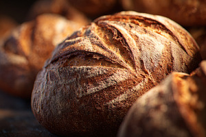 Warm bread sits on a wooden surface, a Photo by Beautiful things