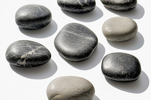 Smooth River Stones in Neutral Tones on White Background, an Abstract Photo by Natalia Klenova's Shop
