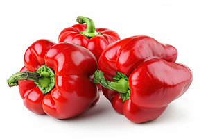 Ripe red peppers isolated on white background, a Food & Drink Photo by AlyaAnd
