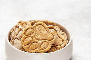 Homemade paw print dog treats in bowl, a Food & Drink Photo by Olena Rudo