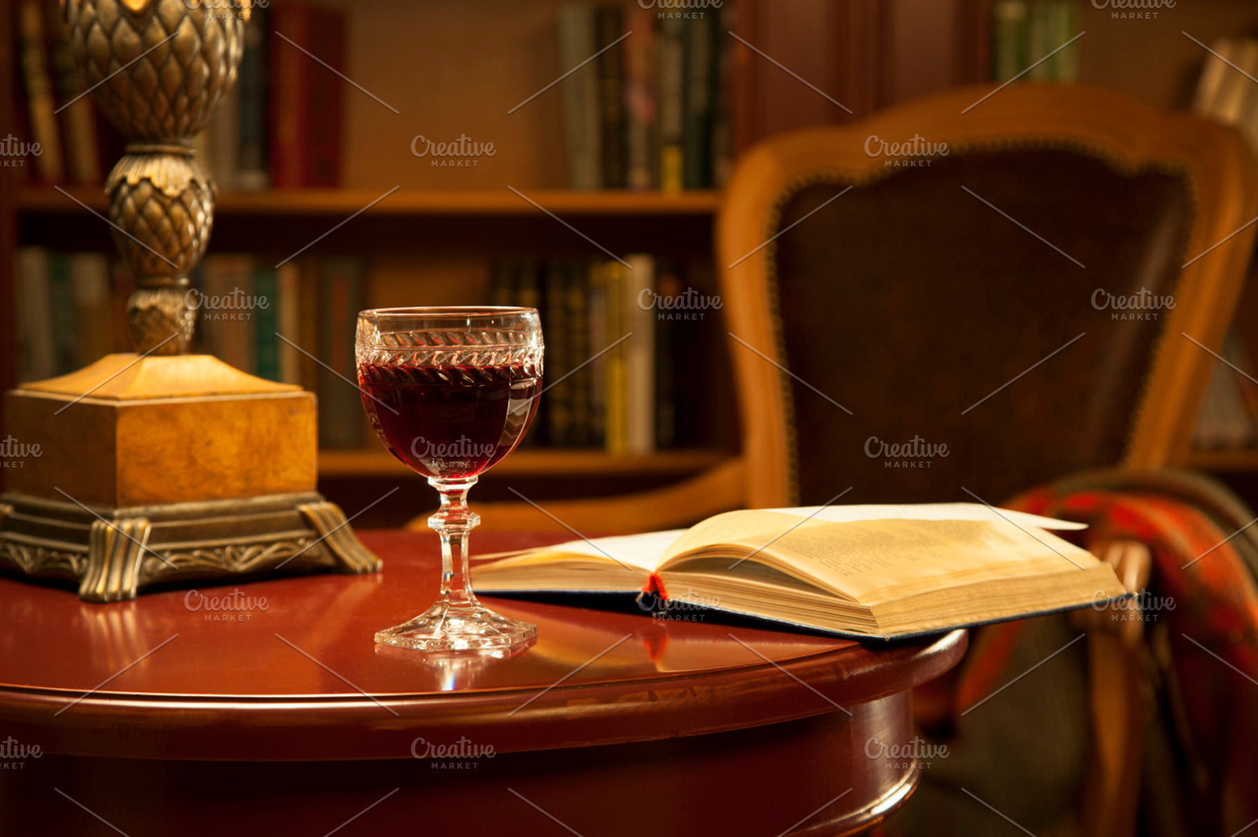 A Glass Of Red Wine And Books