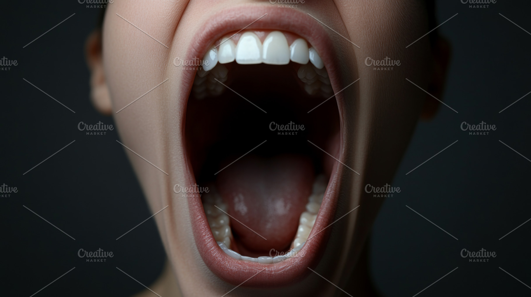 Open human mouth with visible teeth, tongue and throat on dark b, a Photo by Dvoevnore photos