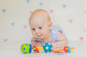 Adorable baby playing with colorful, a Person Photo by Elizaveta Galitskaya