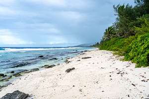 Tropical beach with white sand and turquoise waters on Huahine i, a Nature Photo by GoodGoods