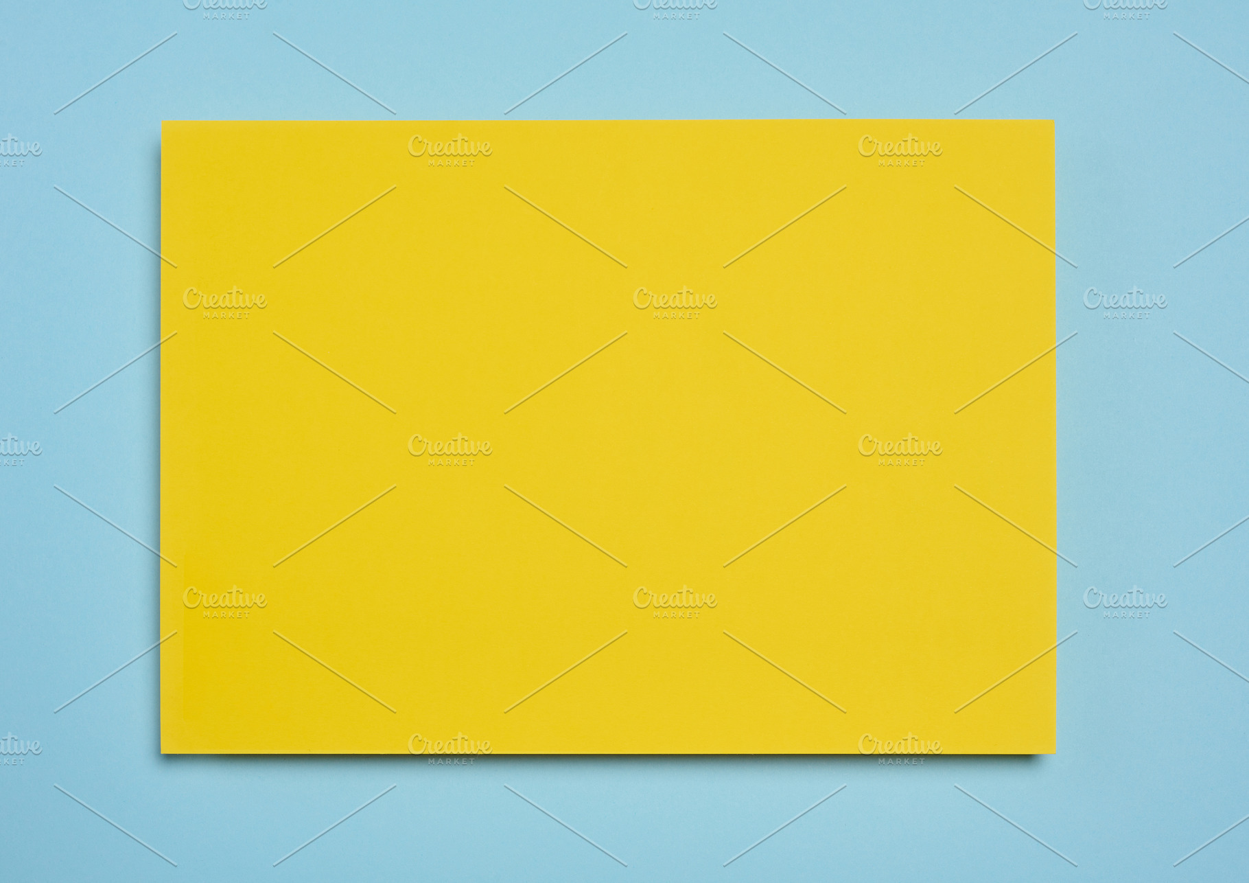 Blank yellow sheet of paper on blue background, abstract backdro, a Background Photo by ndanko