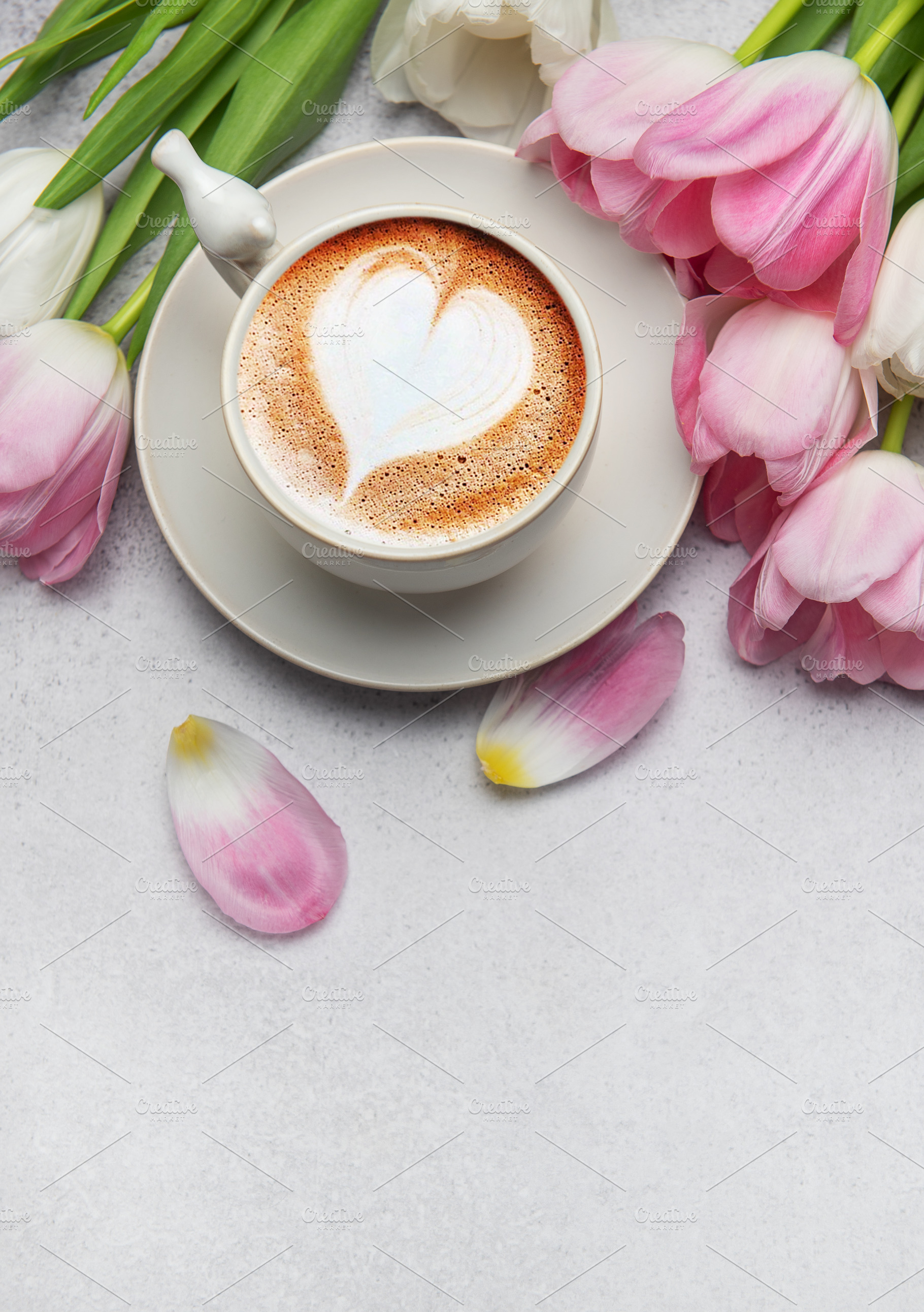 Cappuccino with heart shaped foam and pink tulips bouquet on gre, a Holiday Photo by Olena Rudo