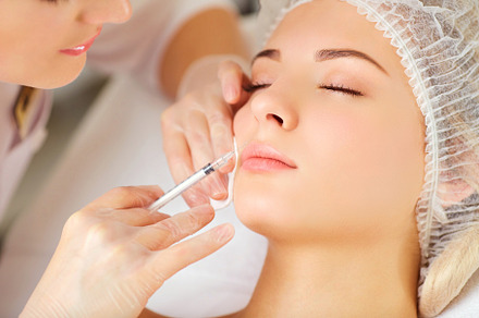 A woman receives an inejection on her face featuring botox, injection, and, a Health & Medical Photo by StudioRomantic