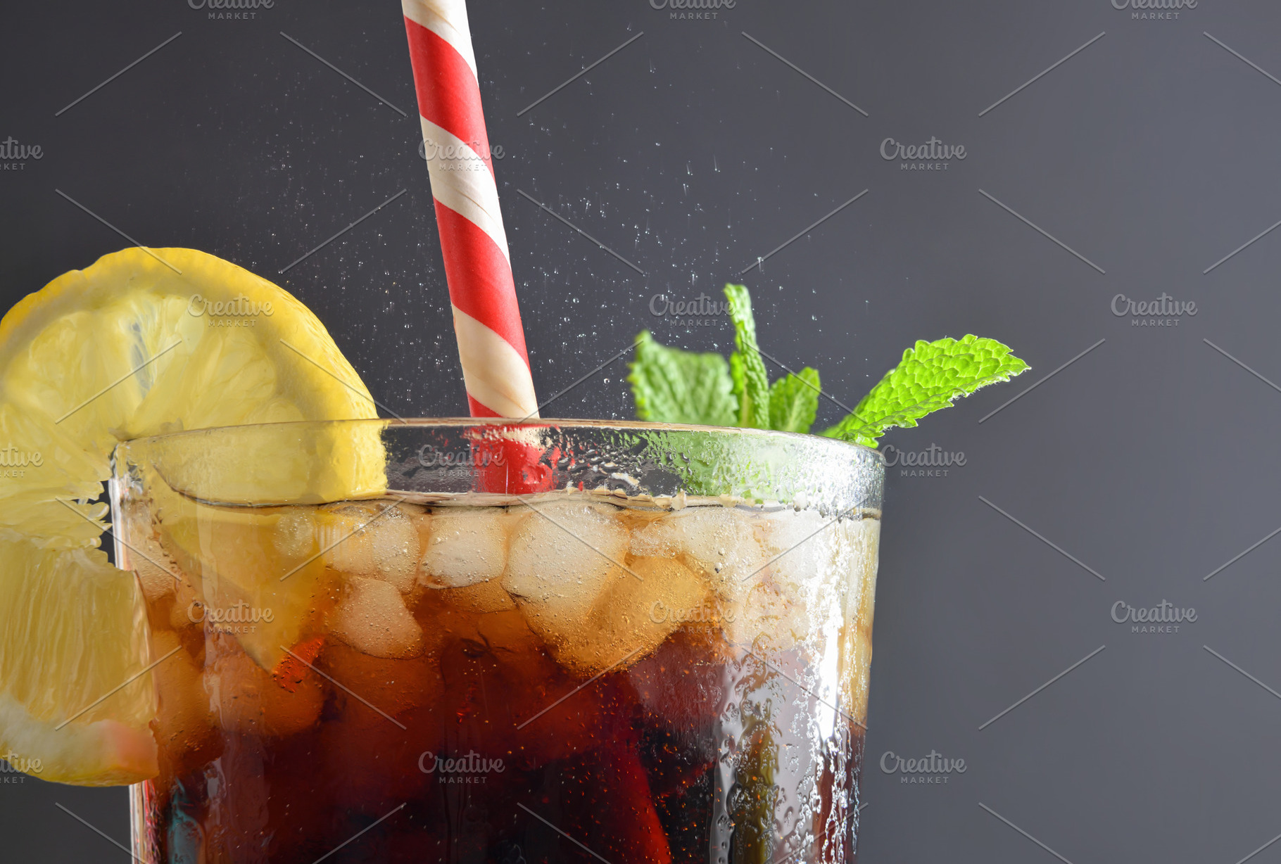 Refreshing drink with ice, mint and lemon isolated on grey, a Food & Drink Photo by Davizro's Market