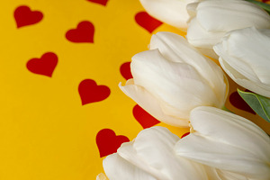 red hearts and white tulip flowers pasted on yellow paper, a Photo by rsoollAI