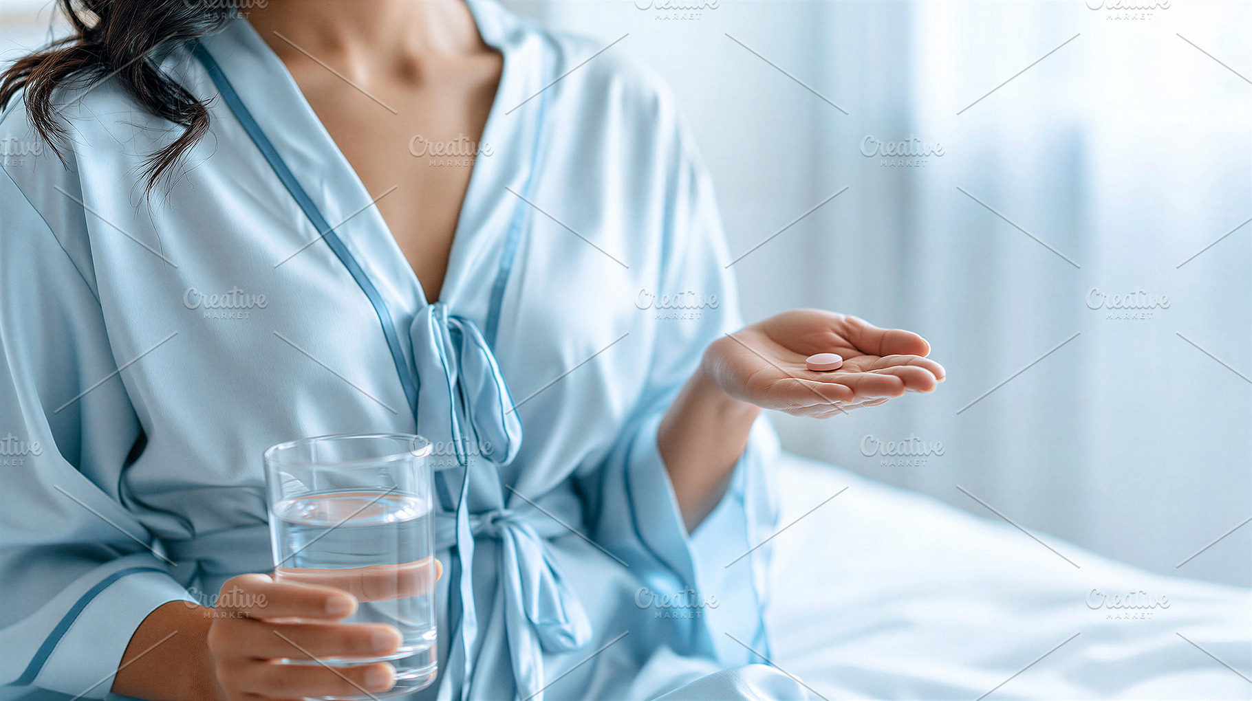 Woman taking medication with water, a Health & Medical Photo by 7DesignLab