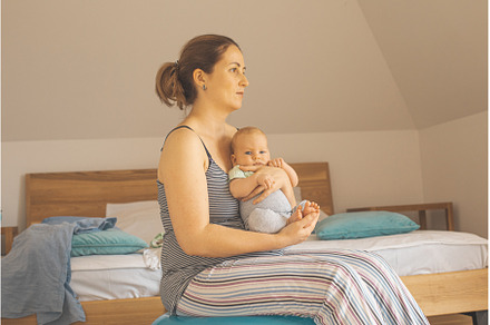 Mother holding and rocking baby, a Person Photo by oksix